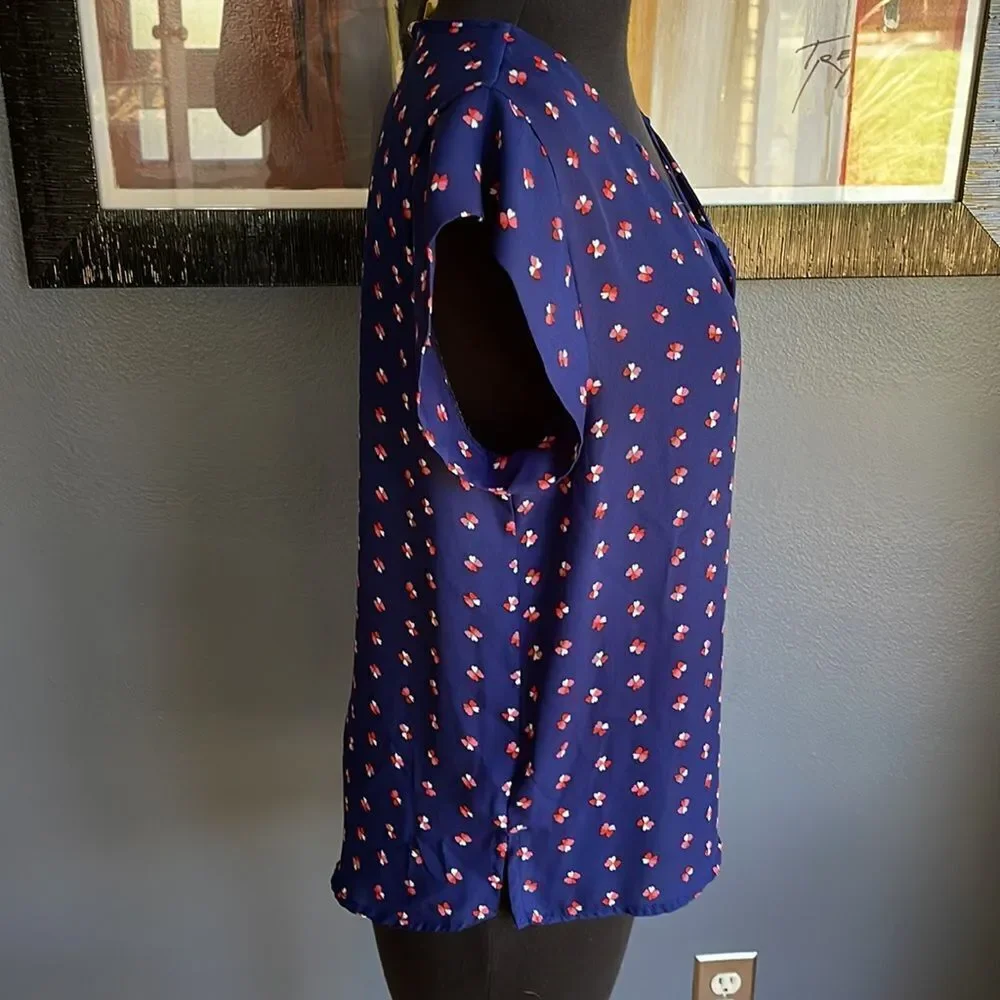 Lily White navy tiny heart flowers pattern X neckline top. Medium.